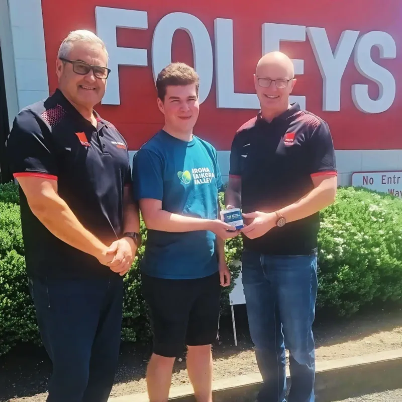 A local business being gifted a monitor to host