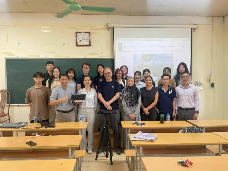 The AirGradient team on-site in Hanoi, Vietnam, alongside the UNDP team and students