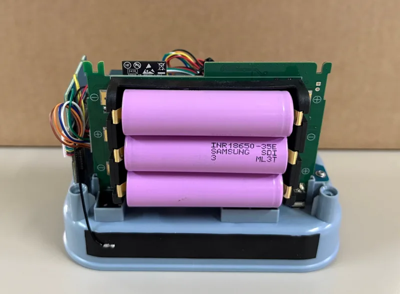 Three 18650 batteries installed inside the AirGradient Open Air Max