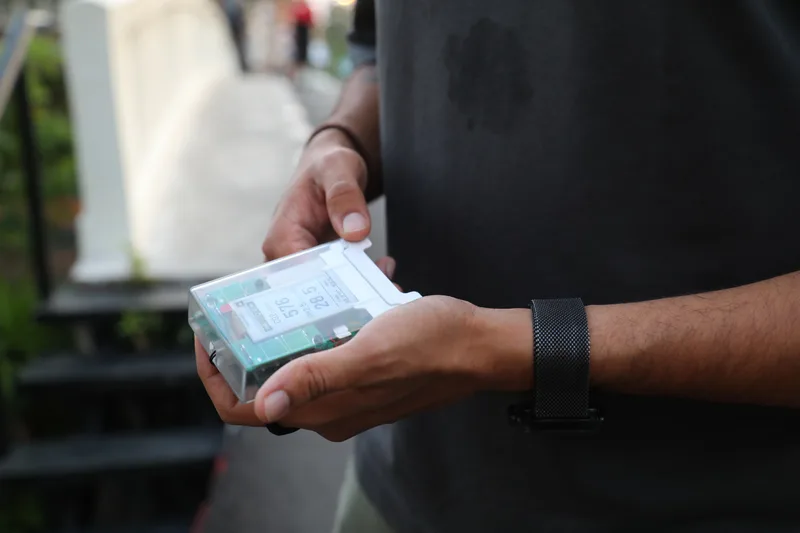 A participant using the AirGradient Go