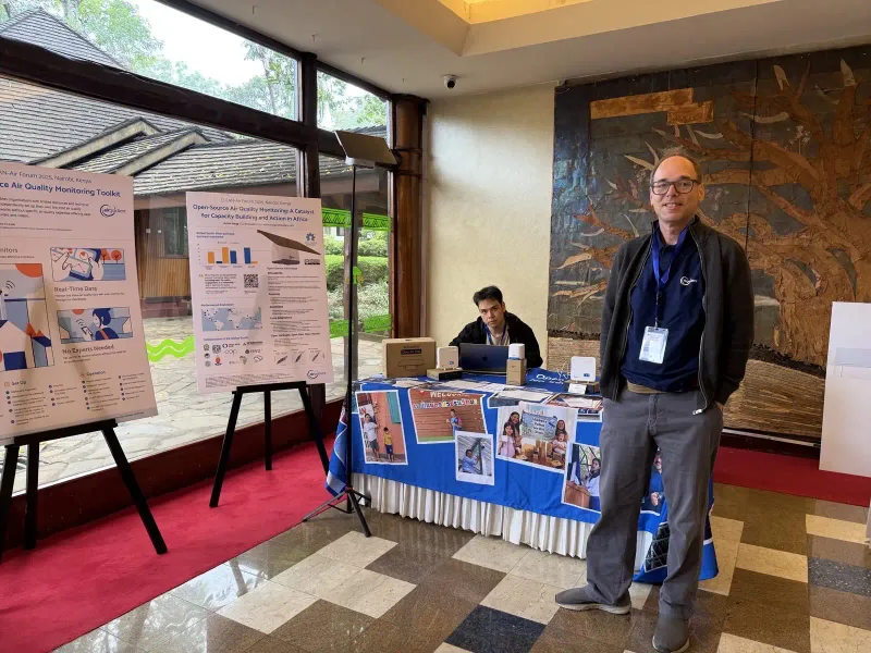 AirGradient exhibition table at the Clean Air Forum with open-source monitors on display